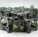 piece of glasswork: Detroit skyline cast in glass and place atop a V8 engine